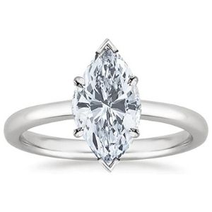 anillo de compromiso tipo marquesa, de oro blanco de 18k con diamante